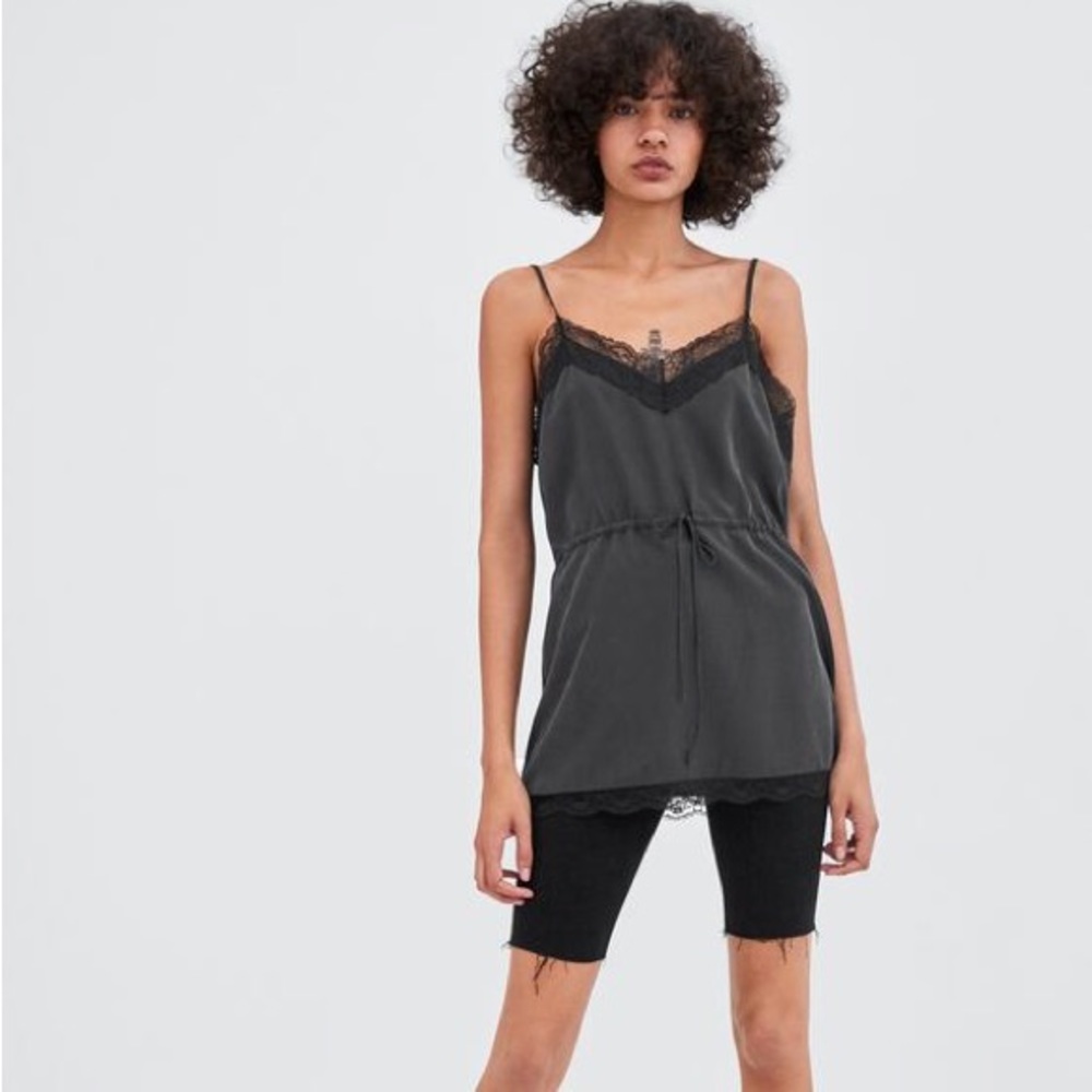 Black tank top with lace trim and adjustable waist band string never worn
